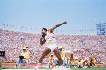 Daley Thompson putting the shot during the decathlon at the 1984 Olympic Games.
