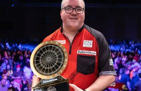 Darts player Stephen Bunting with his 2024 Masters trophy.
