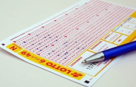 A Lottery Ticket Getting Filled with Pen