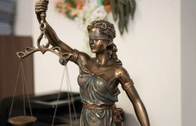 An Image of Temida Holding Scales