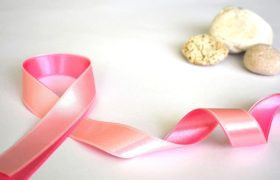 An image showing a pink ribbon in support of breast cancer awareness.