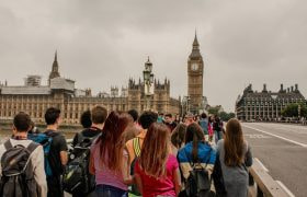 An image showing tourists looking towards the UK's House of Commons.