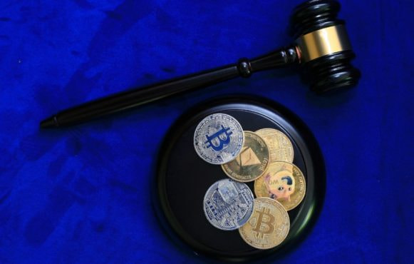 An Assortment of Crypto Coins and a Gavel