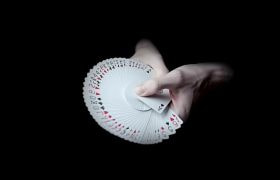 A Deck of Cards Being Spread in a Person’s Hands