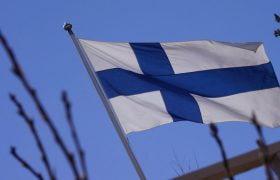 An Image Showing the Finland Flag Fluttering in the Wind.