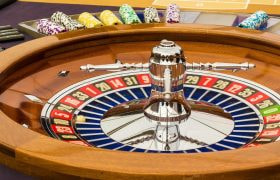 A Gaming Table With a Roulette Wheel