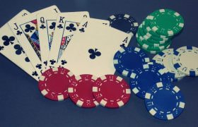 Poker Cards Showing a Royal Flush and Betting Chips