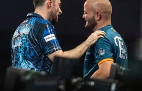 Darts players Thibault Tricole and Luke Humphries.