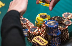 A Handsome Stack of Chips Before a Player at a Poker Table
