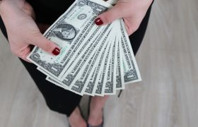 Woman Holding Banknotes