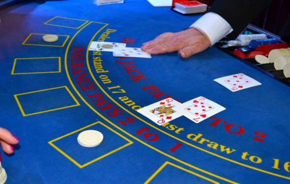 A Blackjack Table with Some Hands Dealt
