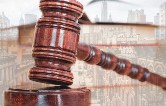 A Court Hammer with Buildings on the Background