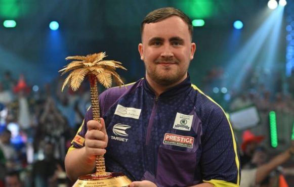 Luke Littler with the 2024 Bahrain Darts Masters Trophy.