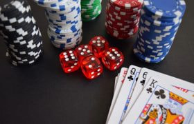 Dice, Cards and Poker Chips on a Table