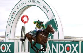 Paul Townend celebrates on board I Am Maximus as the pair win the 2024 Grand National.