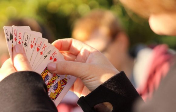 A player with a hand of cards