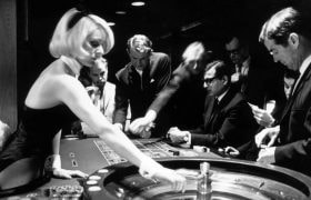A Bunny Girl croupier spinning a roulette wheel in London's Playboy Club (1967)