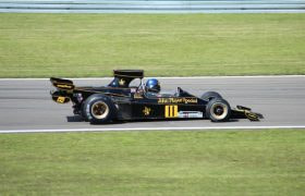 A Race Car Driving Around a Track at High Speed