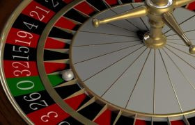 Roulette wheel with ball resting on zero