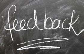A Black Board with "Feedback" Written on It