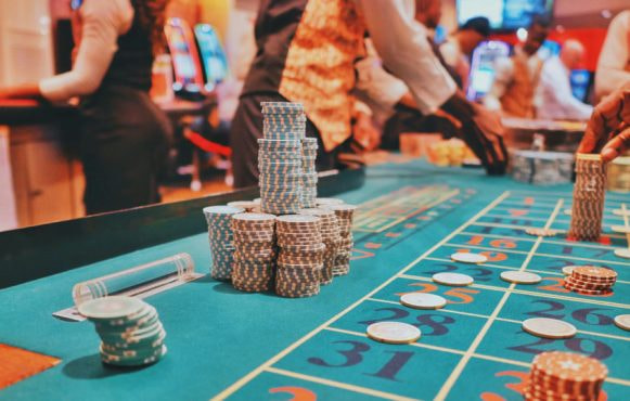 An image showing a casino table covered in chips