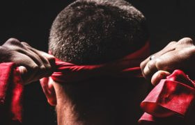 A Fighter Tieing a Headband