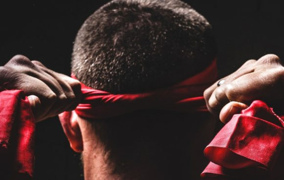 A Fighter Tieing a Headband