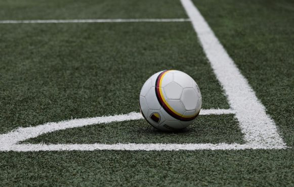A Football Near the Corner Flag of the Pitch