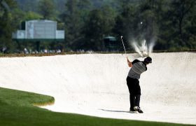Rory McIlroy hits from the bunker on the second hole during the final round of the 2011 Masters.