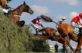 Horses Jumping Aintree's Famous Grand National Fences