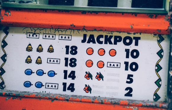 Vintage slot machine paytable showing classic symbols and jackpot amounts