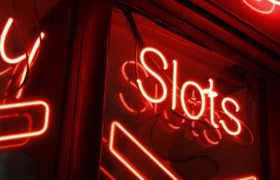 The Word 'Slots' on a Neon Sign
