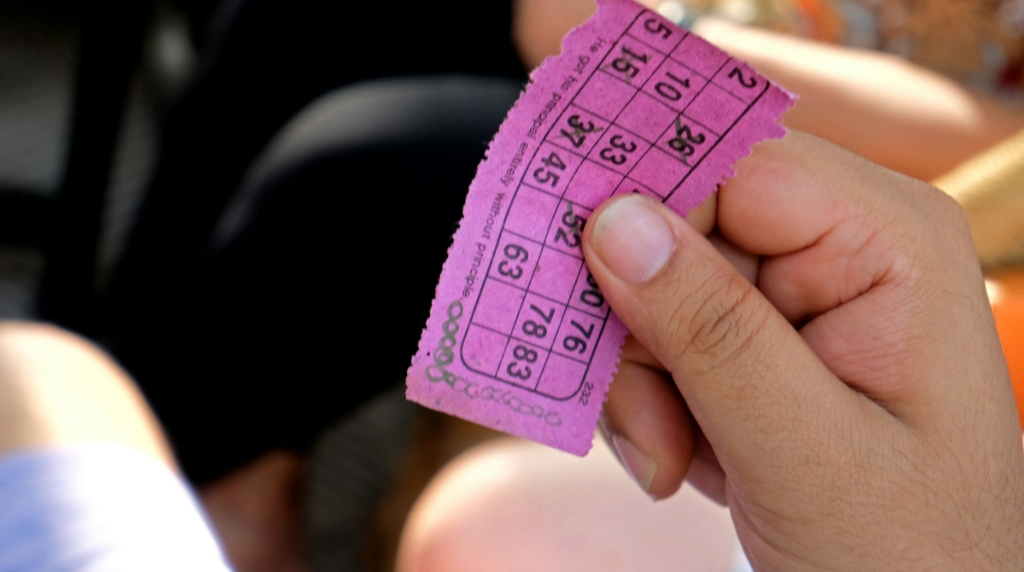 A Hand Holding a Bingo Ticket