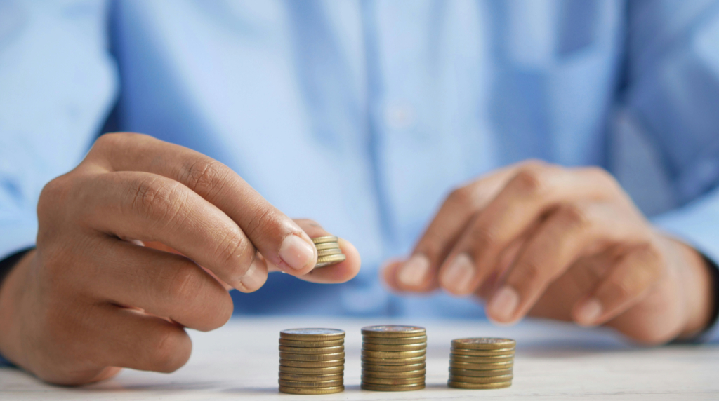 An image showing piles of coins demonstrating investment