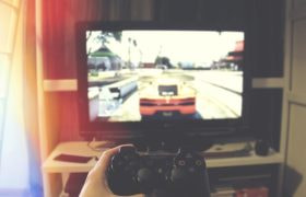 Someone Playing a Video Game on a PlayStation