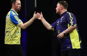 Luke Littler and Luke Humphries Shaking Hands on Stage.