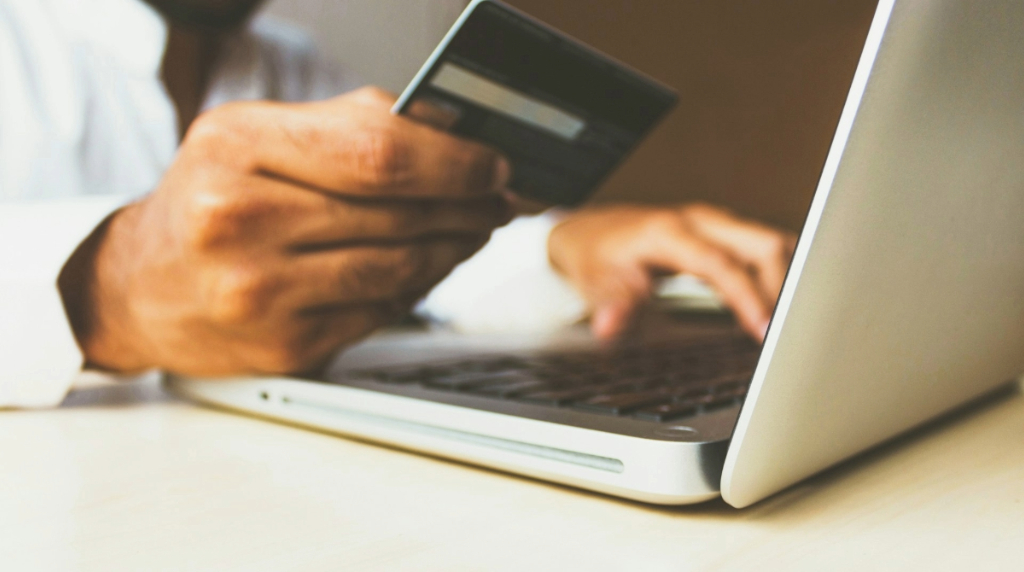 A Person Paying Online Using a Card