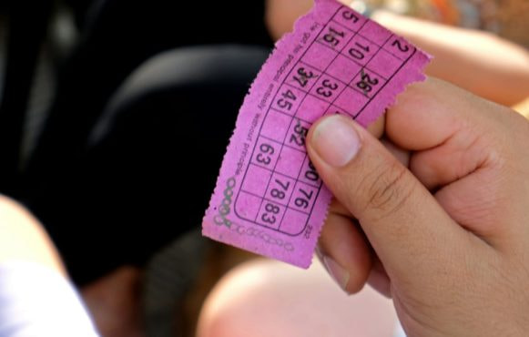 A Person Holding a Bingo Ticket