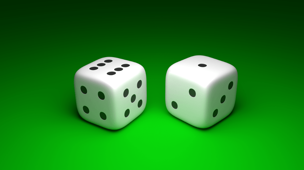 Two Six-Sided Dice on a Gaming Table