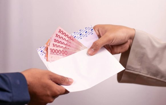 People Handing an Envelope with Money
