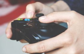Someone Using a Controller to Play a Video Game
