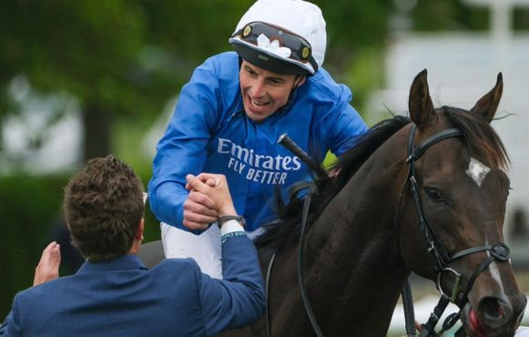 William Buick celebrates after riding Ruling Court to win the Betfred 2000 Guineas.