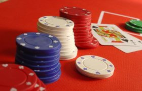 Gaming Chips and Playing Cards Worth 21