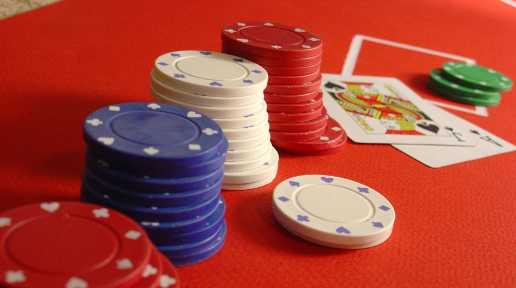 Gaming Chips and Playing Cards Worth 21
