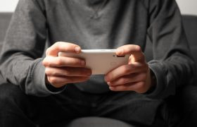 Someone Playing a Game on Their Phone