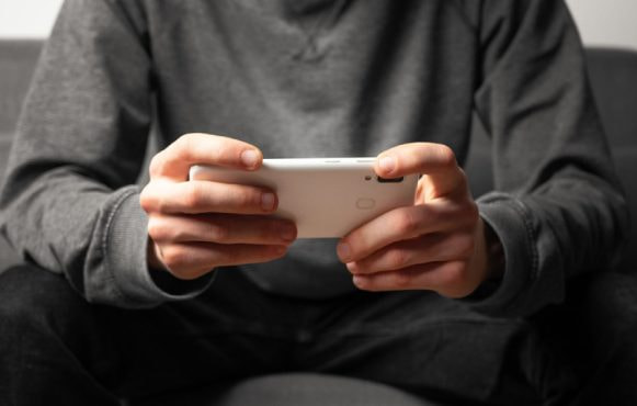 Someone Playing a Game on Their Phone