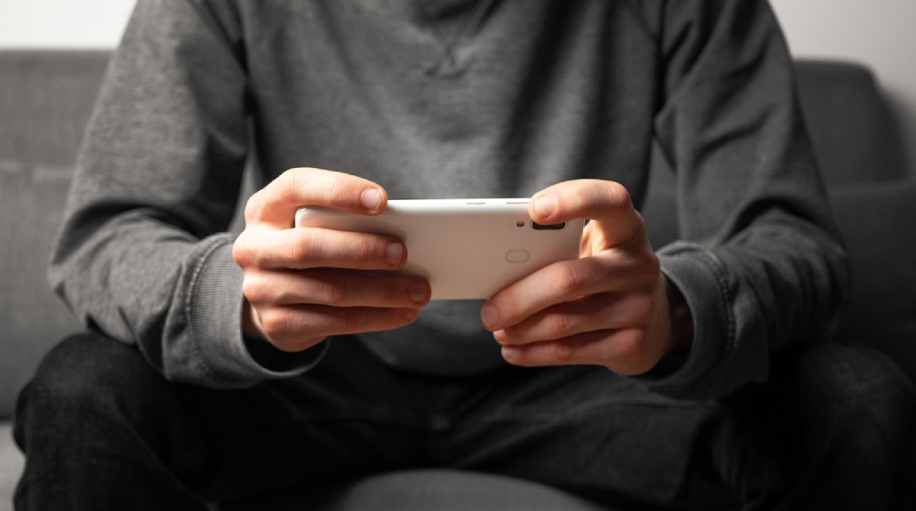 Someone Playing a Game on Their Phone