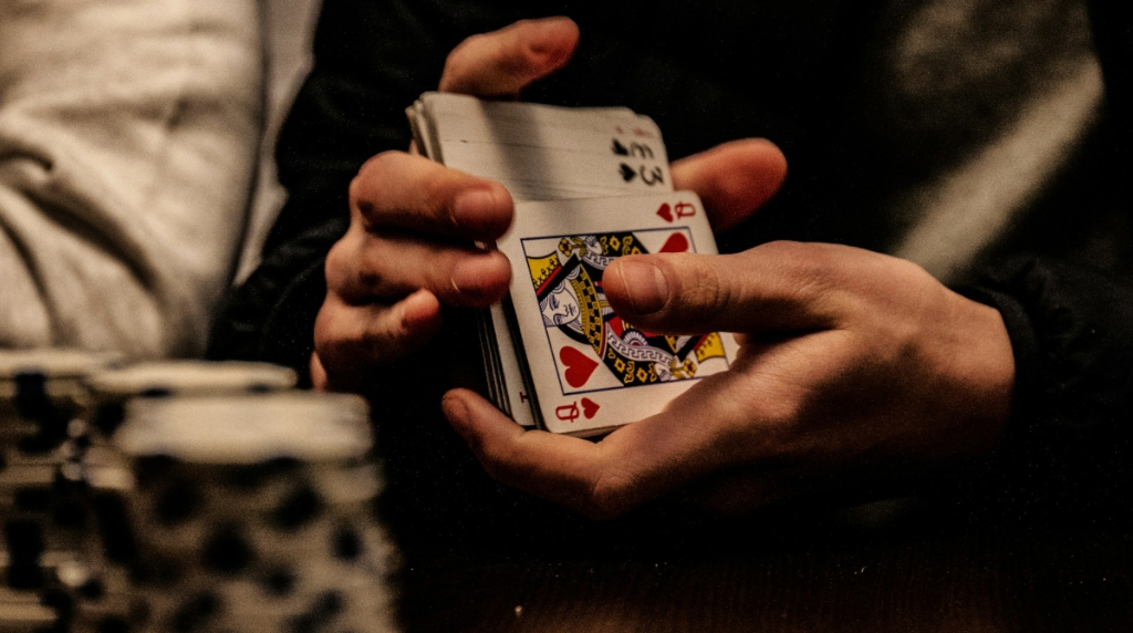 A Man Shuffling Poker Cards