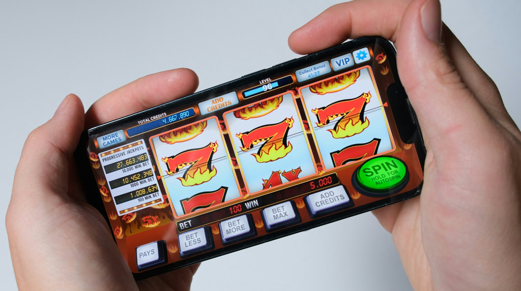 Someone Playing a Slot on Their Phone