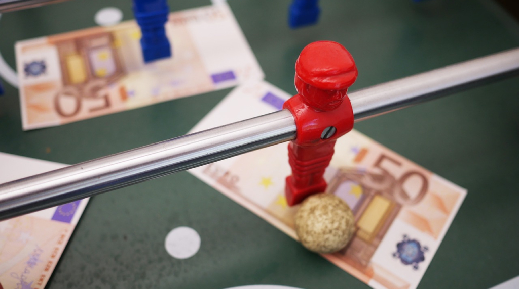 Banknotes on a Foosball Playfield